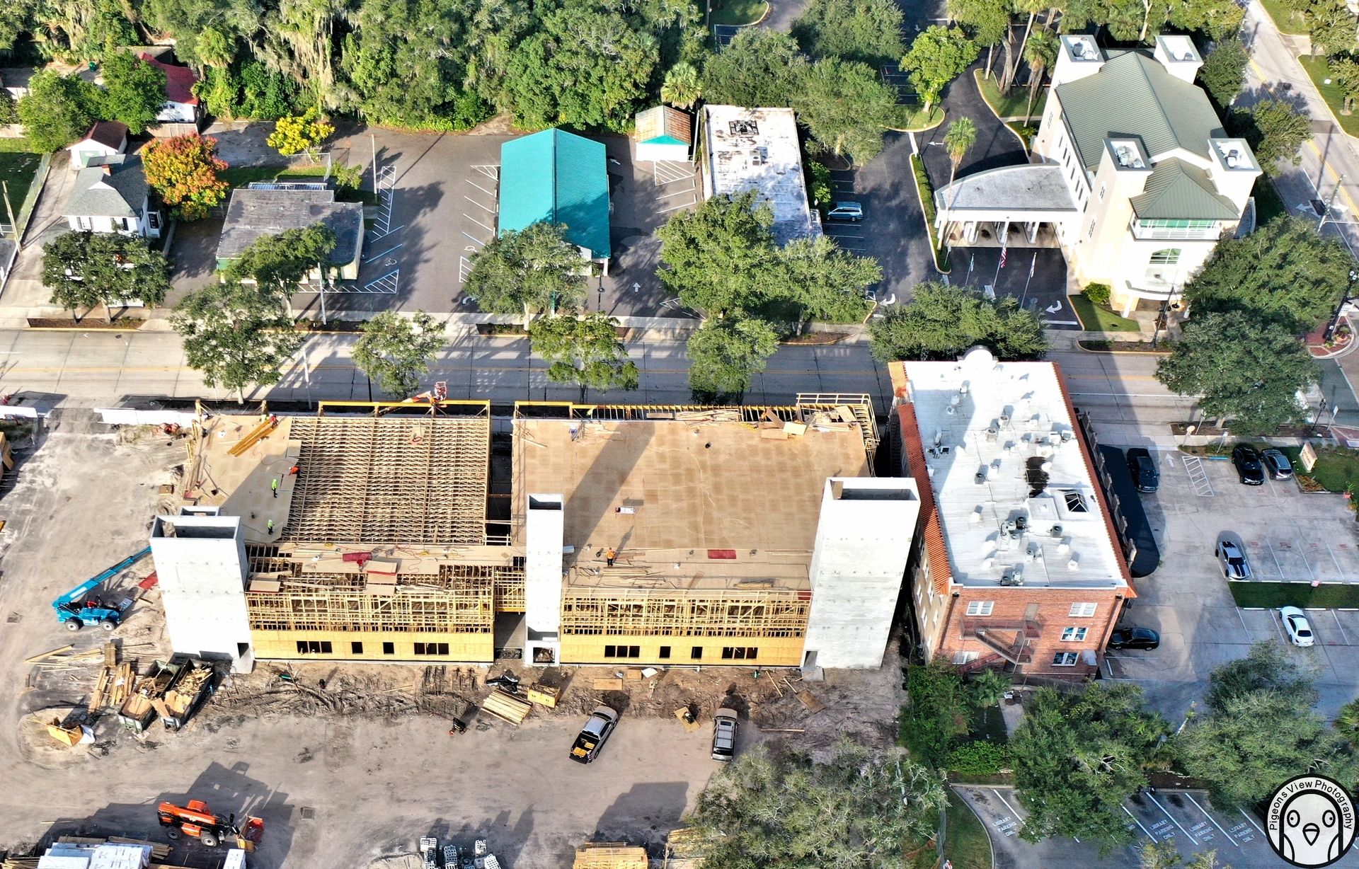Building under construction surrounded by trees