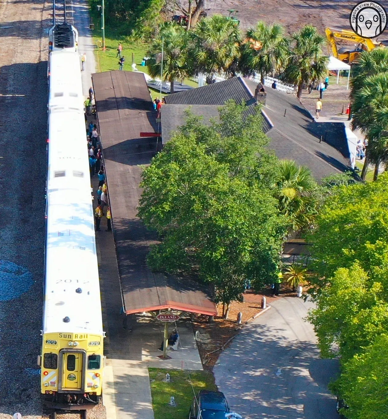 Train stopped near a small station building