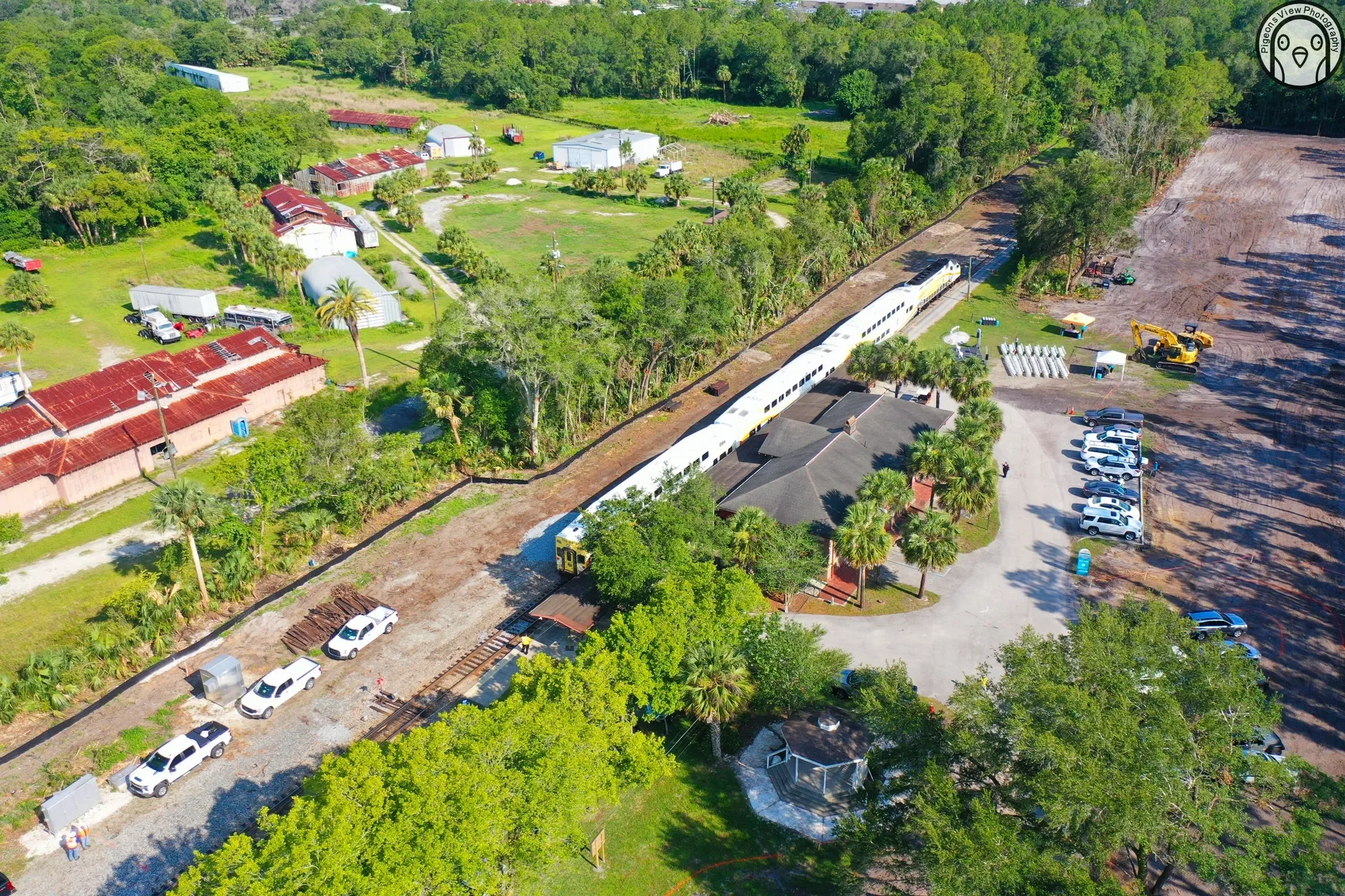 Rural landscape with houses and train tracks