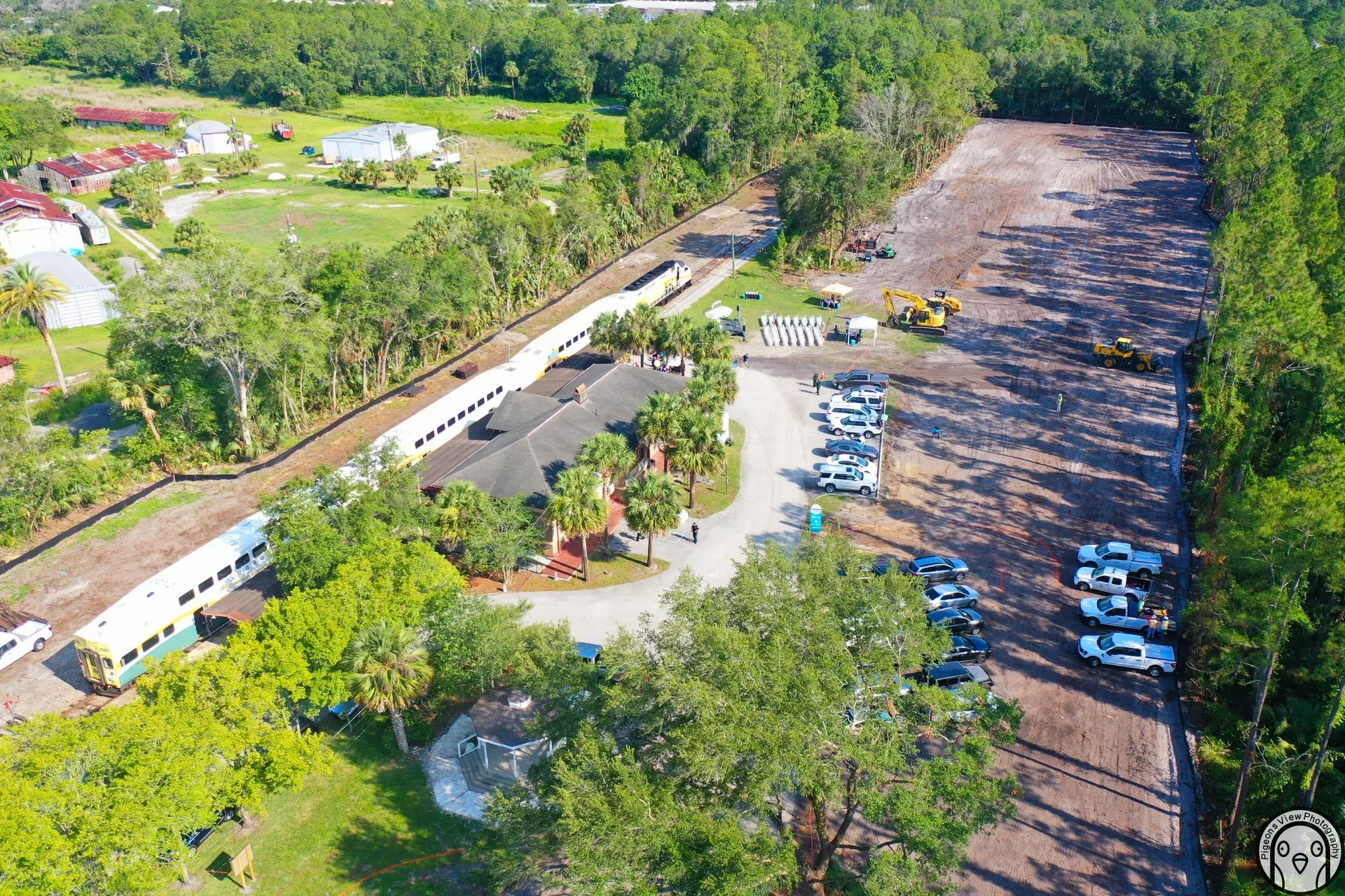 Aerial view of construction site and vehicles.